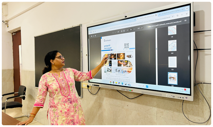 Teacher presenting on high tech smart board